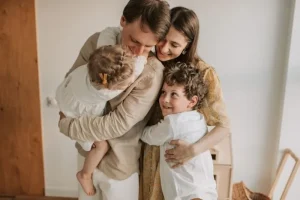 Happy family smiling together, representing the success of surrogacy and egg donation journeys supported by Northeast Assisted Fertility Group