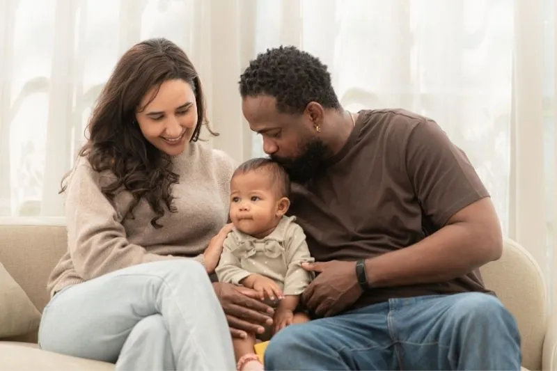 International family with their baby after completing a U.S. surrogacy journey