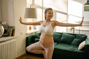 Repeat surrogate doing yoga during her second surrogacy journey